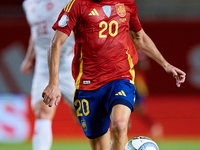 Pedri of Spain is in action during the UEFA Nations League 2024/25 League A Group A4 game between Spain and Denmark at Enrique Roca Stadium...