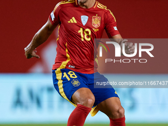 Martin Zubimendi of Spain is in action during the UEFA Nations League 2024/25 League A Group A4 game between Spain and Denmark at Enrique Ro...