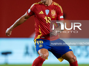 Martin Zubimendi of Spain is in action during the UEFA Nations League 2024/25 League A Group A4 game between Spain and Denmark at Enrique Ro...