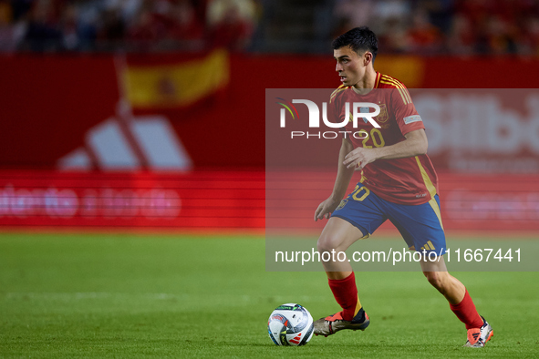 Pedri of Spain is in action during the UEFA Nations League 2024/25 League A Group A4 game between Spain and Denmark at Enrique Roca Stadium...