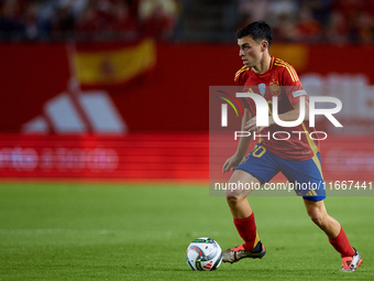 Pedri of Spain is in action during the UEFA Nations League 2024/25 League A Group A4 game between Spain and Denmark at Enrique Roca Stadium...