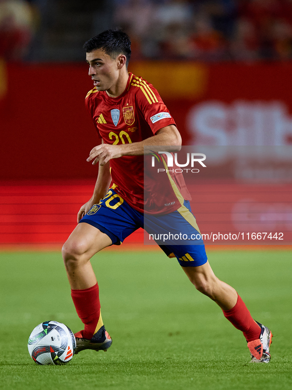 Pedri of Spain is in action during the UEFA Nations League 2024/25 League A Group A4 game between Spain and Denmark at Enrique Roca Stadium...