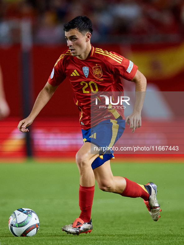 Pedri of Spain is in action during the UEFA Nations League 2024/25 League A Group A4 game between Spain and Denmark at Enrique Roca Stadium...