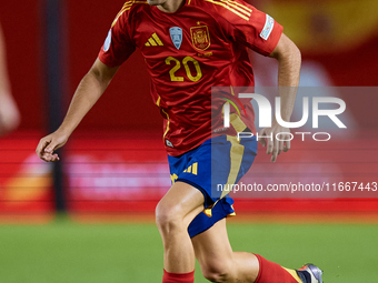 Pedri of Spain is in action during the UEFA Nations League 2024/25 League A Group A4 game between Spain and Denmark at Enrique Roca Stadium...