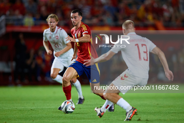 Fabian Ruiz of Spain competes for the ball with Rasmus Kristensen of Denmark during the UEFA Nations League 2024/25 League A Group A4 game b...