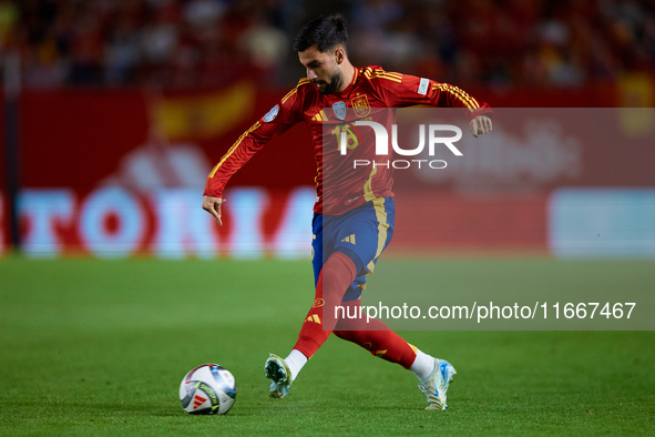 Alex Baena of Spain is in action during the UEFA Nations League 2024/25 League A Group A4 game between Spain and Denmark at Enrique Roca Sta...