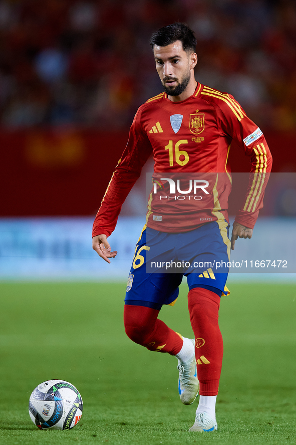 Alex Baena of Spain is in action during the UEFA Nations League 2024/25 League A Group A4 game between Spain and Denmark at Enrique Roca Sta...