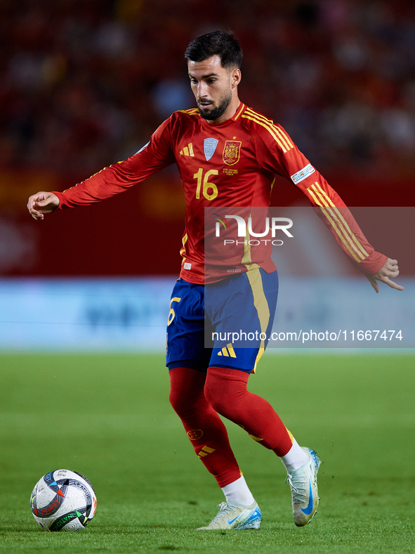 Alex Baena of Spain is in action during the UEFA Nations League 2024/25 League A Group A4 game between Spain and Denmark at Enrique Roca Sta...