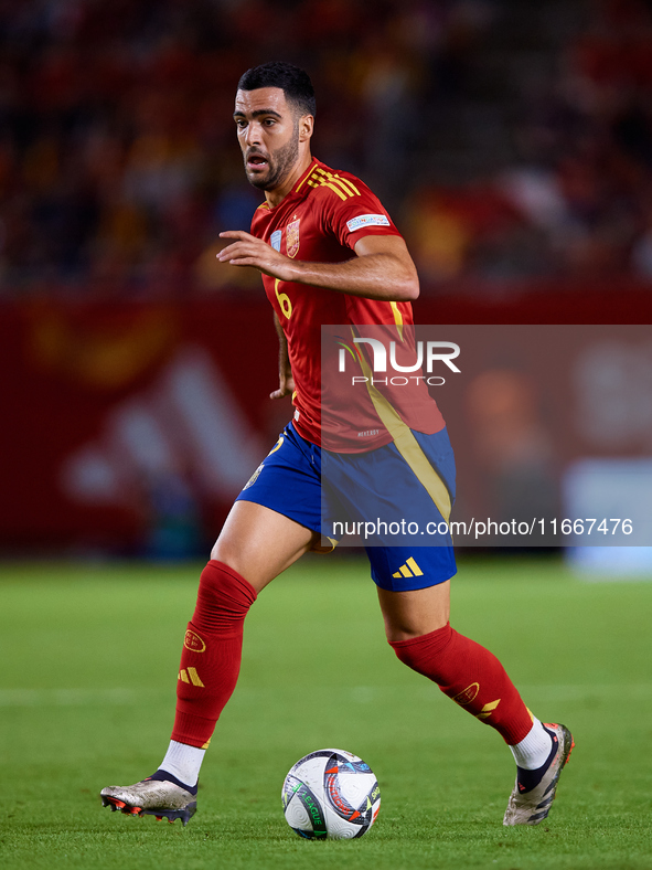 Mikel Merino of Spain is in action during the UEFA Nations League 2024/25 League A Group A4 game between Spain and Denmark at Enrique Roca S...