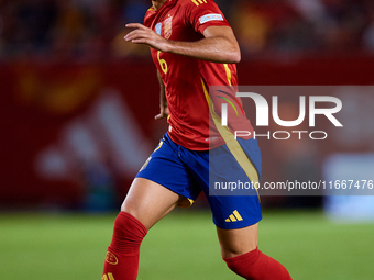 Mikel Merino of Spain is in action during the UEFA Nations League 2024/25 League A Group A4 game between Spain and Denmark at Enrique Roca S...