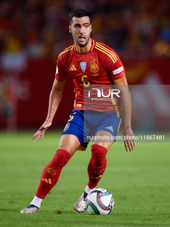 Mikel Merino of Spain is in action during the UEFA Nations League 2024/25 League A Group A4 game between Spain and Denmark at Enrique Roca S...