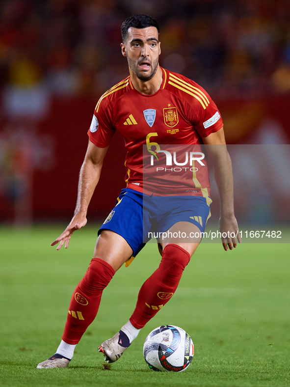 Mikel Merino of Spain is in action during the UEFA Nations League 2024/25 League A Group A4 game between Spain and Denmark at Enrique Roca S...