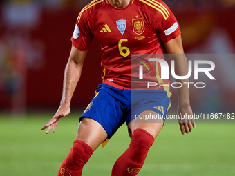 Mikel Merino of Spain is in action during the UEFA Nations League 2024/25 League A Group A4 game between Spain and Denmark at Enrique Roca S...