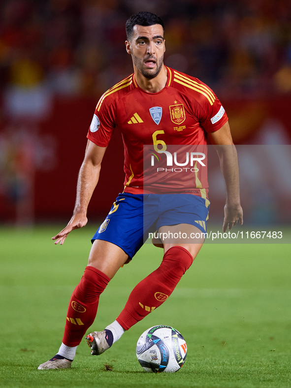 Mikel Merino of Spain is in action during the UEFA Nations League 2024/25 League A Group A4 game between Spain and Denmark at Enrique Roca S...