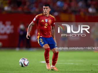 Pedro Porro of Spain plays during the UEFA Nations League 2024/25 League A Group A4 game between Spain and Denmark at Enrique Roca Stadium i...