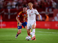 Isaksen of Denmark competes for the ball with Aymeric Laporte of Spain during the UEFA Nations League 2024/25 League A Group A4 game between...