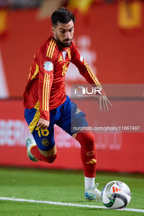 Alex Baena of Spain is in action during the UEFA Nations League 2024/25 League A Group A4 game between Spain and Denmark at Enrique Roca Sta...