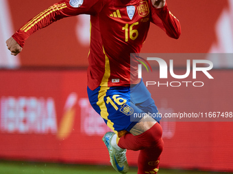 Alex Baena of Spain is in action during the UEFA Nations League 2024/25 League A Group A4 game between Spain and Denmark at Enrique Roca Sta...