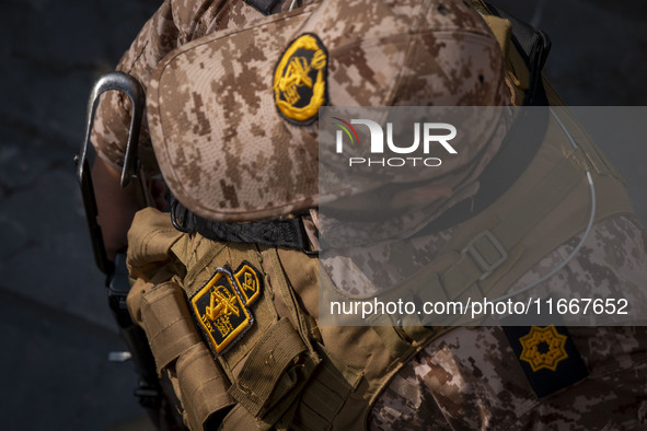 An IRGC armed military personnel monitors an area during a funeral for a commander of the Islamic Revolutionary Guard Corps' (IRGC) Quds For...