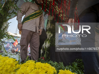 A truck carries a coffin containing the body of Abbas Nilforoushan, a commander of the Islamic Revolutionary Guard Corps' (IRGC) Quds Force,...