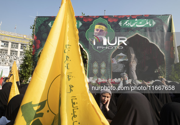 A truck carries a coffin containing the body of Abbas Nilforoushan, a commander of the Islamic Revolutionary Guard Corps' (IRGC) Quds Force,...