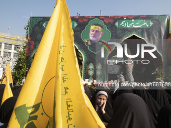 A truck carries a coffin containing the body of Abbas Nilforoushan, a commander of the Islamic Revolutionary Guard Corps' (IRGC) Quds Force,...