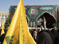 A truck carries a coffin containing the body of Abbas Nilforoushan, a commander of the Islamic Revolutionary Guard Corps' (IRGC) Quds Force,...