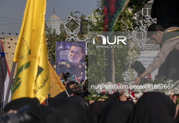 A banner features a portrait of Abbas Nilforoushan, a commander of the Islamic Revolutionary Guard Corps' (IRGC) Quds Force, who is killed i...