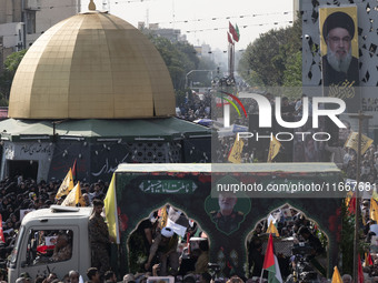 Iranian mourners take part in a funeral as a truck carries a coffin containing the body of a commander of the Islamic Revolutionary Guard Co...