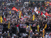 Iranian mourners take part in a funeral as a truck carries a coffin containing the body of a commander of the Islamic Revolutionary Guard Co...