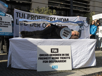 Singer Sarah Connor lies in a mini-aquarium and protests with PETA activists in front of a TUI travel agency for the release of orca whales...