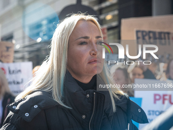 Singer Sarah Connor lies in a mini-aquarium and protests with PETA activists in front of a TUI travel agency for the release of orca whales...