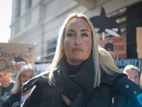 Singer Sarah Connor lies in a mini-aquarium and protests with PETA activists in front of a TUI travel agency for the release of orca whales...