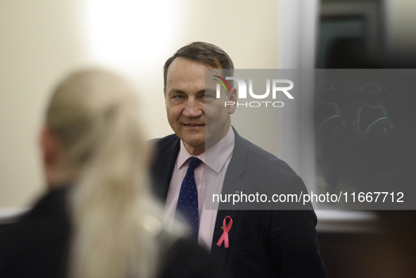 Polish Minister of Foreign Affairs Radoslaw Sikorski looks on as he arrives at the weekly ministerial meeting in Warsaw, Poland, on October...