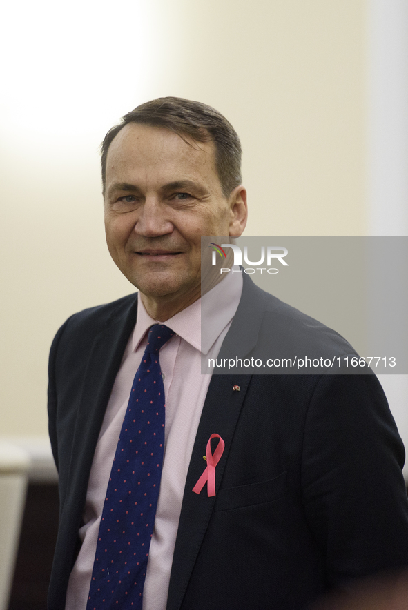 Polish Minister of Foreign Affairs Radoslaw Sikorski looks on as he arrives at the weekly ministerial meeting in Warsaw, Poland, on October...