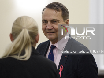 Polish Minister of Foreign Affairs Radoslaw Sikorski looks on as he arrives at the weekly ministerial meeting in Warsaw, Poland, on October...