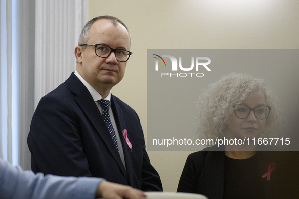 Polish Minister of Justice Adam Bodnar (L) and Equality Minister Katarzyna Kotula (R) look on as they arrive at the weekly ministerial meeti...