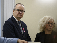 Polish Minister of Justice Adam Bodnar (L) and Equality Minister Katarzyna Kotula (R) look on as they arrive at the weekly ministerial meeti...