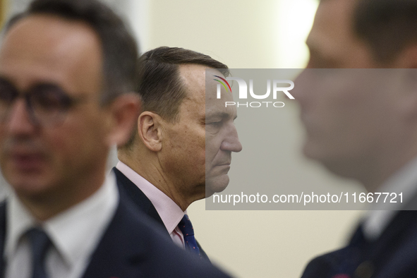 Polish Minister of Foreign Affairs Radoslaw Sikorski looks on as he arrives at the weekly ministerial meeting in Warsaw, Poland, on October...