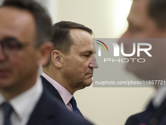 Polish Minister of Foreign Affairs Radoslaw Sikorski looks on as he arrives at the weekly ministerial meeting in Warsaw, Poland, on October...