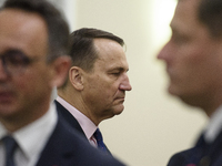 Polish Minister of Foreign Affairs Radoslaw Sikorski looks on as he arrives at the weekly ministerial meeting in Warsaw, Poland, on October...