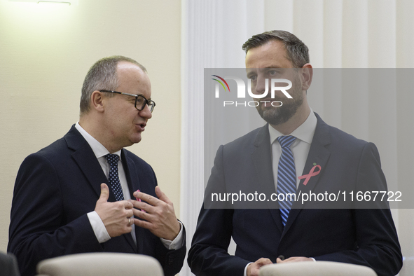 Polish Justice Minister Adam Bodnar and Polish Deputy Prime Minister and Defence Minister Wladyslaw Kosiniak-Kamysza talk as they arrive at...