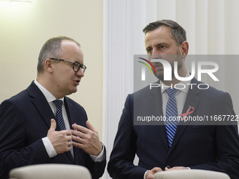 Polish Justice Minister Adam Bodnar and Polish Deputy Prime Minister and Defence Minister Wladyslaw Kosiniak-Kamysza talk as they arrive at...