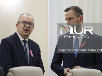 Polish Justice Minister Adam Bodnar and Polish Deputy Prime Minister and Defence Minister Wladyslaw Kosiniak-Kamysza talk as they arrive at...