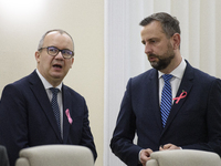 Polish Justice Minister Adam Bodnar and Polish Deputy Prime Minister and Defence Minister Wladyslaw Kosiniak-Kamysza talk as they arrive at...