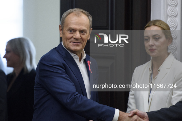 Poland's PM Donald Tusk looks on as he arrives at the weekly Ministerial meeting in Warsaw, Poland, on October 15, 2024. 