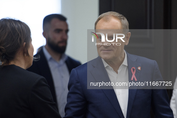 Poland's PM Donald Tusk looks on as he arrives at the weekly Ministerial meeting in Warsaw, Poland, on October 15, 2024. 