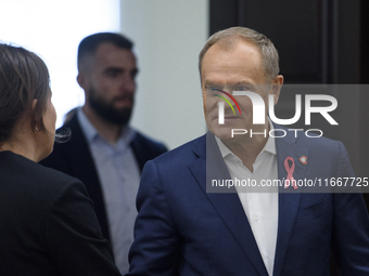 Poland's PM Donald Tusk looks on as he arrives at the weekly Ministerial meeting in Warsaw, Poland, on October 15, 2024. (