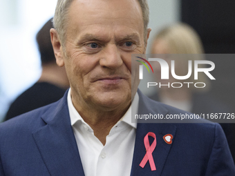 Poland's PM Donald Tusk looks on as he arrives at the weekly Ministerial meeting in Warsaw, Poland, on October 15, 2024. (