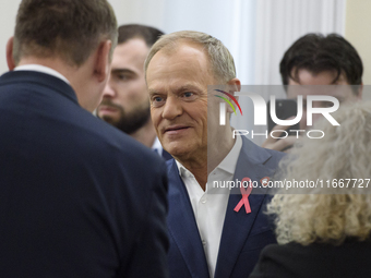 Poland's PM Donald Tusk looks on as he arrives at the weekly Ministerial meeting in Warsaw, Poland, on October 15, 2024. (